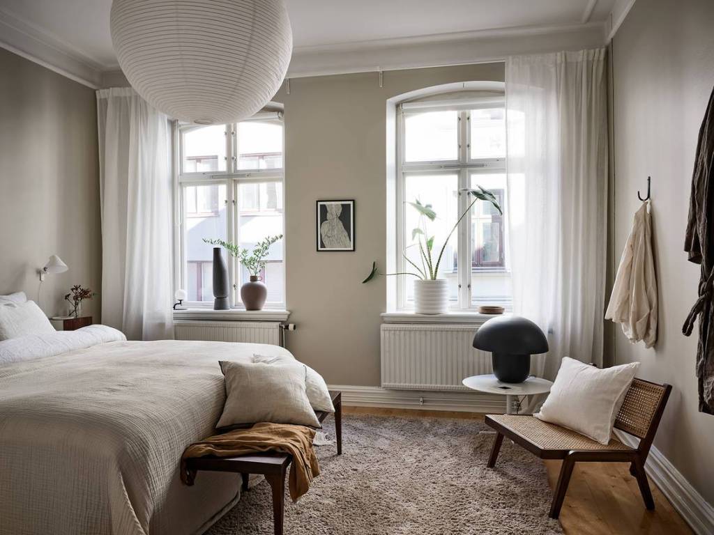 Cozy rental apartment with soft beige curtains + bright décor.