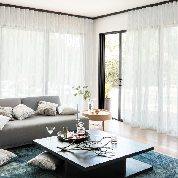 wave fold curtains installed from ceiling to floor in Dubai living room
