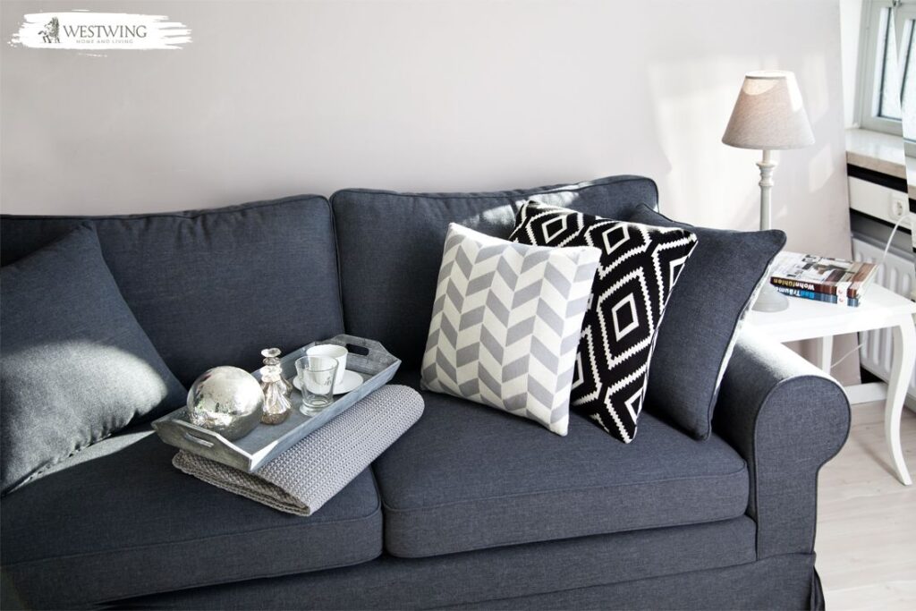 modern grey sofa in bright living room with soft cushions and natural light 1