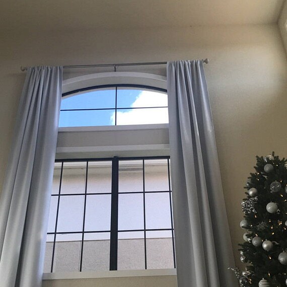 Modern home office with tailored curtains enhancing focus and professional ambiance11